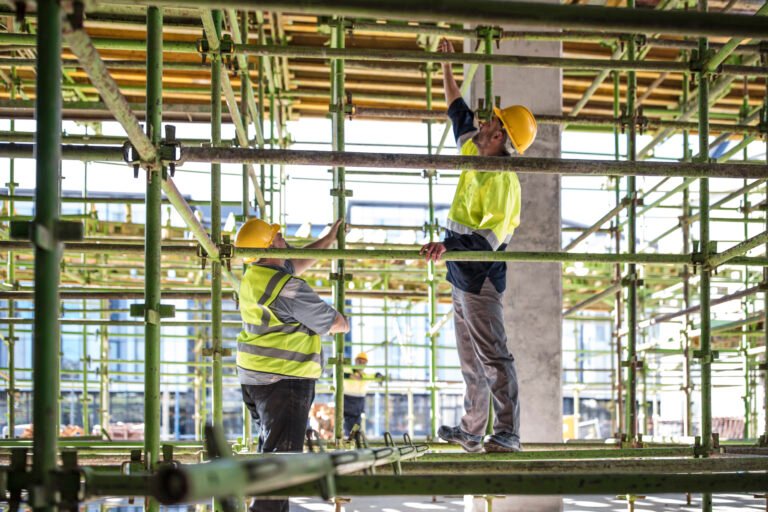 Construction workers on scaffolding