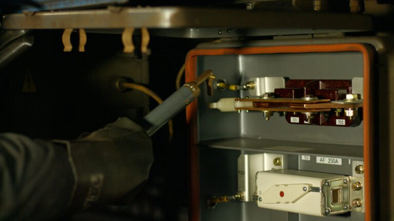 Electrician repairs mechanism. Electrical connection. Electropanel board.